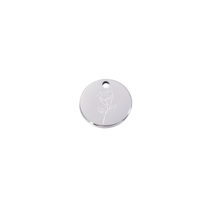 Macro shot of a silver mirror-finish stainless steel round pendant with etched rose detail