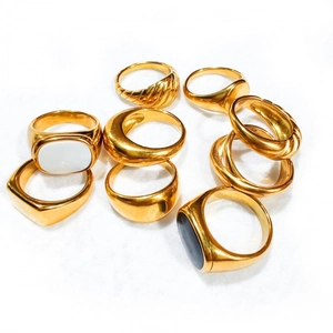 Set of 9 gold stainless steel rings featuring shell and black agate style inlays