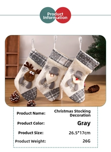 Close-up of rustic grey Christmas stockings with elk, Santa, and snowman embroidery