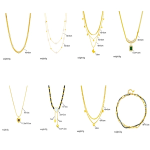 Gold layered necklace set featuring pearls, butterfly pendants and zircon stones on white background