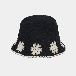 Japanese style black crochet bucket hat with white floral pattern and hollow knit design