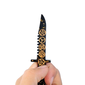 Handheld view of a steampunk resin dagger mold featuring gold gears and foil flakes