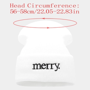 Detail shot of white beanie showing merry embroidery and 56-58cm head size label