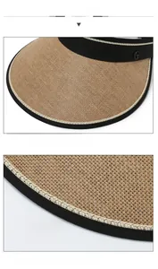 Detail of straw sun visor with G-logo metal charm and reinforced black edge stitching