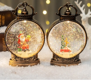 Detail of vintage bronze Christmas lanterns with Santa and truck in warm LED snow scene