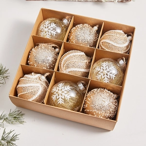 Set of 9 Christmas tree ornaments featuring gold glitter, pearls, and transparent snowflake designs