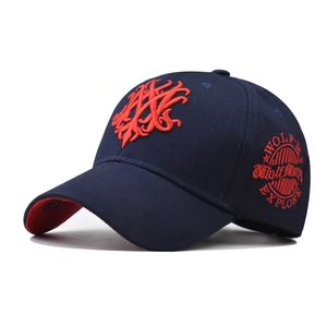 Close-up of Navy cotton baseball cap featuring 3D red embroidery and Wolf Master logo