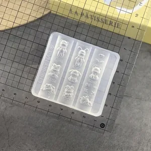 Detailed view of translucent silicone nail art mold with various 3D animal patterns