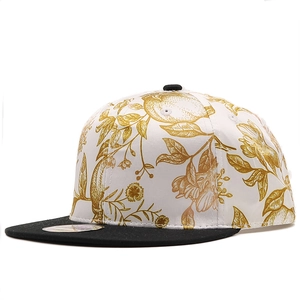 Flat brim snapback hat with white floral print body and black peak for sun protection