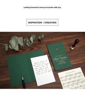 Retro dark green greeting card with gold stamping, metal bird detail and premium stationery