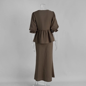 Back view of brown two-piece set featuring ruffle hem top and long maxi skirt