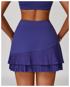 Detail view of the pleated hem and high waistband on this purple sports skirt