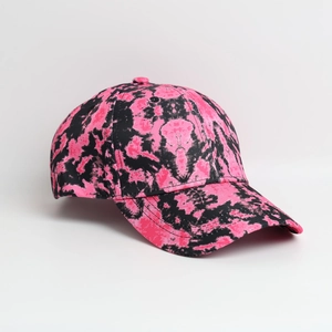 Detailed macro view of the pink and black tie-dye pattern on a six-panel baseball cap