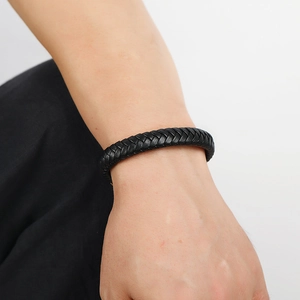 Minimalist woven black leather bracelet for men featuring a secure magnetic metal clasp