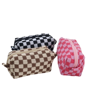 Three checkered knit cosmetic bags in black, brown, and pink with secure zippers