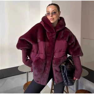 Detail of burgundy patchwork jacket showing faux fur texture and ribbed knit cuffs