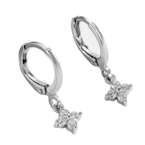 Macro shot of silver clover drop earrings with sparkling zircon inlay for women