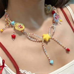 Collier de perles coloré style Y2K avec nœud papillon et breloques cœur et étoile