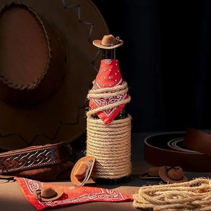 Macro detail of mini brown cowboy hat and rope decoration on a decorative bottle cover