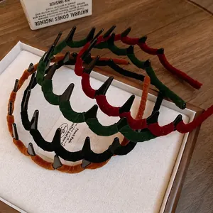 Set of four flocking wavy hairbands in vintage green, black, red, and orange tones
