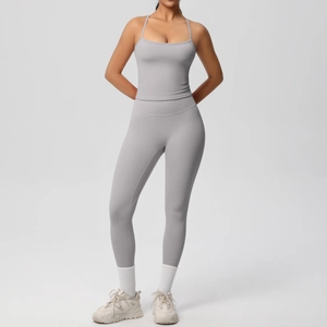 Detail of light gray yoga set featuring thin strap U-neck top and high waist leggings