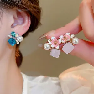 Elegant cherry blossom earrings with enamel flower details and pearls for women