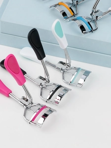 Close-up of portable stainless steel eyelash curlers with colorful non-slip handles