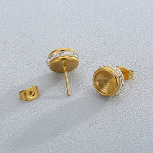 Minimalist gold stud earrings with circular micro-pave zircon crystals and backings