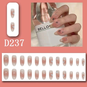 Detailed view of pink gradient press-on nails with glitter rhinestones and 24pc set display