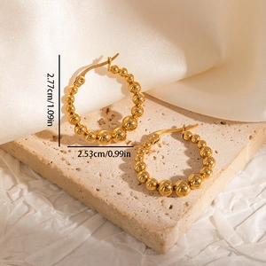 Detailed view of C-shaped gold-plated beaded hoop earrings with precise size dimensions