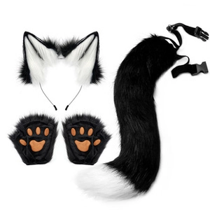 Flat lay of fluffy faux fur fox ears, paw gloves with brown pads, and a tail on white