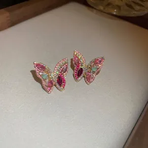 Elegant butterfly stud earrings with pink and purple crystals in gold-plated settings