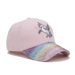 Detail of pink kids baseball cap featuring unicorn embroidery and rainbow sequin visor