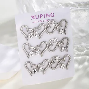 Luxurious silver interlocking heart earrings set with white cubic zirconia on a card
