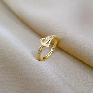 Adjustable gold ginkgo leaf ring with Roman numerals and sparkling cubic zirconia stones
