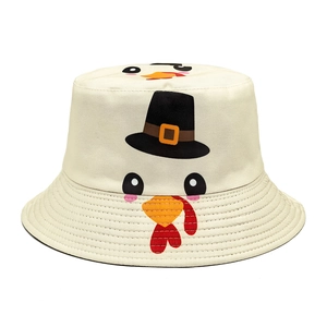 Close-up of cute turkey cartoon embroidery on a beige cotton twill bucket hat