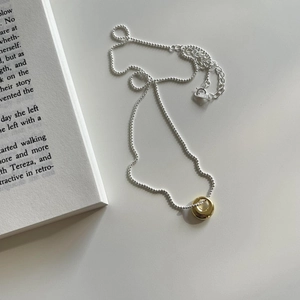 925 sterling silver bead chain with golden irregular oval pendant and lobster clasp