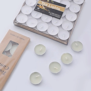 50-piece set of white and green heart-shaped tea light candles in bulk packaging