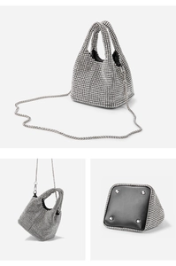 Detail showing silver rhinestone bucket bag bottom with metal studs and chain strap