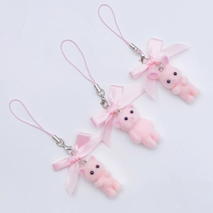 Set of three pink flocked cat phone charms with ribbon bows and metal lobster clasps