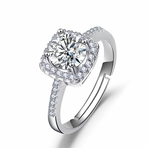 Macro shot of silver ring featuring a large round zircon stone with a halo diamond setting