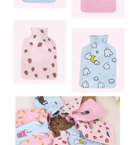 Close-up of cute cartoon plush hot water bottles with strawberry and cactus patterns