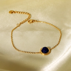French vintage 14K gold plated stainless steel bracelet with a round blue gemstone inlay