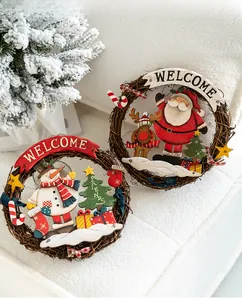 Detail of wooden Christmas welcome wreath with Santa, Snowman and festive vine textures