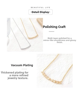 Detail of vacuum plated smile necklace with baguette cut cubic zirconia in gold and silver