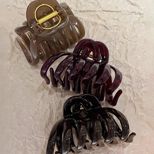 Three acrylic pumpkin stripe hair claws in brown, wine red and black for thick hair