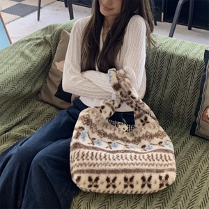 Close-up of plush tote bag featuring vintage Fair Isle geometric patterns and soft texture