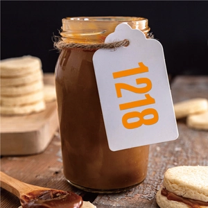 Detail of 1-inch vinyl number sticker on a glass jar with rustic twine and wooden spoon