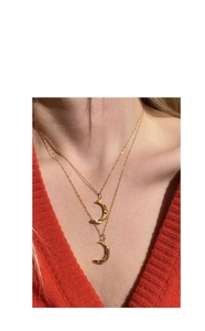 Detail of double-layered gold crescent moon necklaces with unique hammered texture design