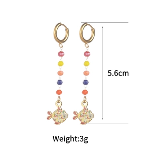 Colorful 18k gold plated beaded earrings with enamel fish pendant on white background